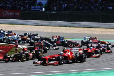 Vettel wins in his home Grand Prix ahead of the fast charging Lotus duo