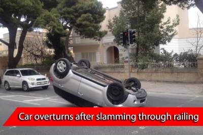 Mazda crashes through railing after mounting grass patch