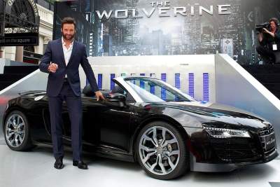 Hugh Jackman arrives at The Wolverine premiere in an Audi R8