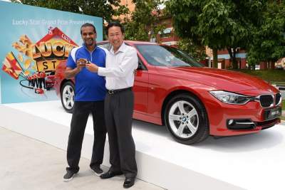 Lucky star defies odds to win dream prize of BMW 316i with Caltex