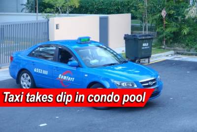 Taxi takes a dip in condominium pool