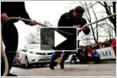 The world's strongest man pulls 12 Nissan Notes straight into record books