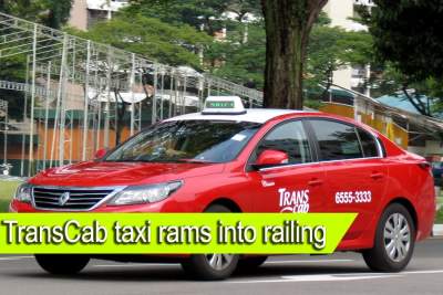 TransCab taxi rams into road railing and lands on side