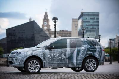 Camouflaged Discovery Sport uncovered with three rows of seats