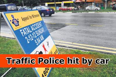 Traffic Police in collision with car on Orchard Road