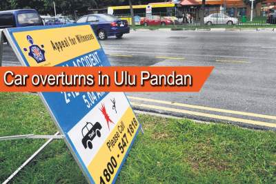 Driver injured as car flips over in Ulu Pandan
