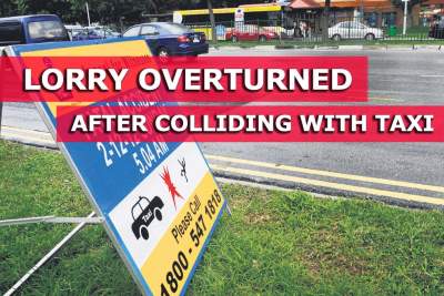 Lorry overturns after colliding with taxi on Outram Road