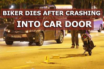 Motorcyclist dies after crashing into car door