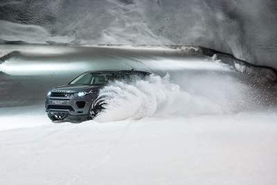 Dog power versus horsepower in Discovery Sport snow tunnel challenge