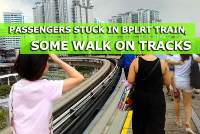 Passengers stuck in LRT train, some walk on tracks