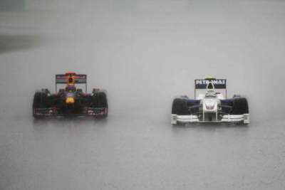 Button classified winner of a very wet M'sian Grand Prix