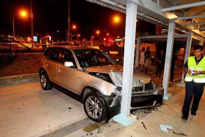 Collision with BMW causes taxi to almost flip over
