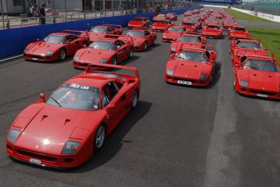 Feast of track parade headed by Ferrari F40s