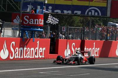 Lewis Hamilton cruises to victory among sea of red
