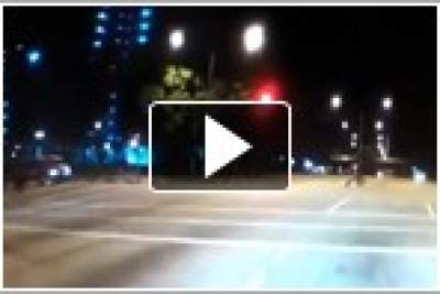 Red-light beating motorcyclist hits crossing pedestrian